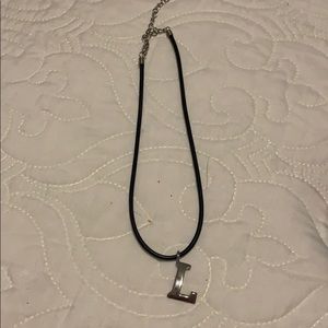 Rubber cord necklace with silver colored L